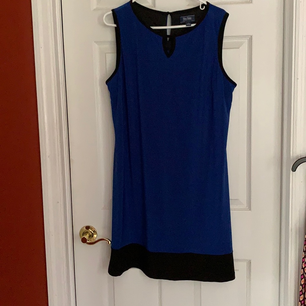 Blue sleeveless dress with black trim